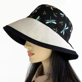 Sunblocker with lovely dragonfly print with black base, adjustable fit, wide brim